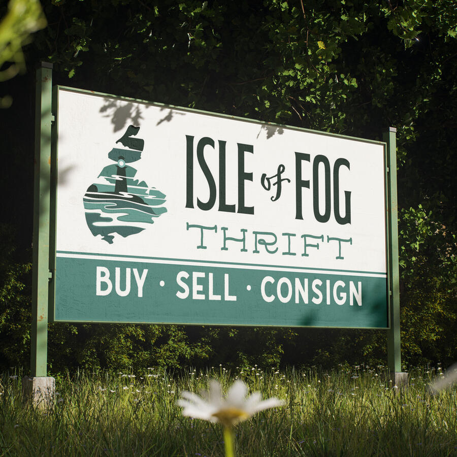 A sign featuring Isle of Fog Thrift. The logo is the shape of Cape Breton, and features a foggy lighthouse scene.