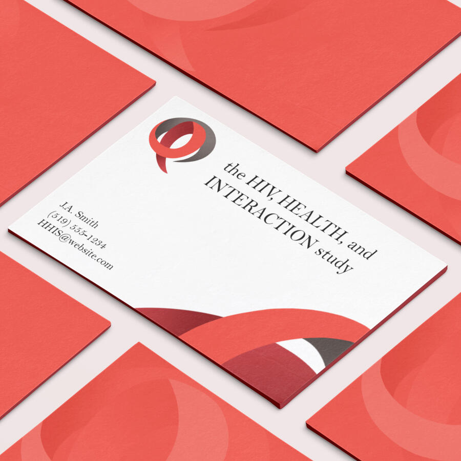 The HIV Health and Interaction study logo, featured on business cards. The logo is a clever blend of a speech bubble paired with the red HIV ribbon.